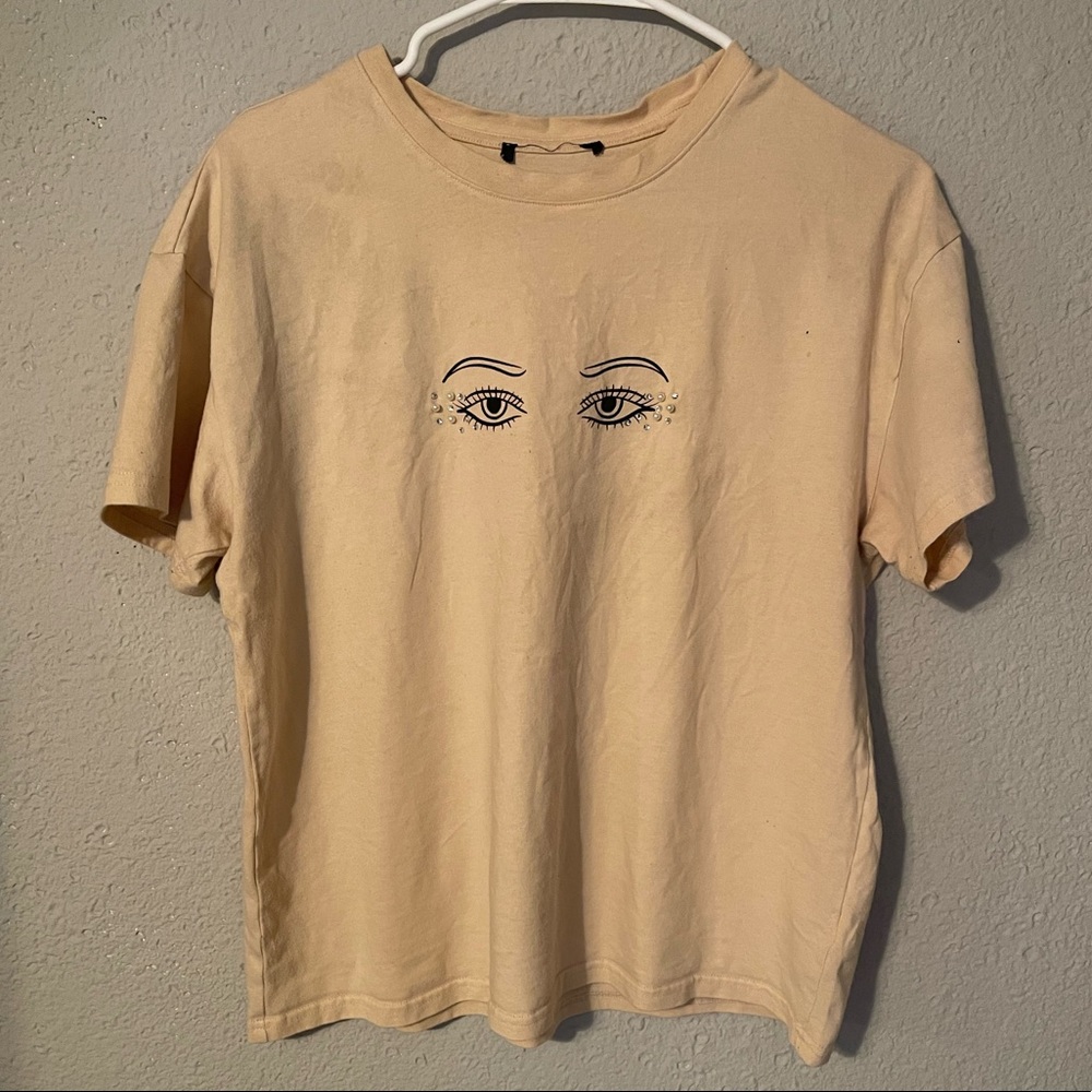 Beige shirt with eye bling and pearls